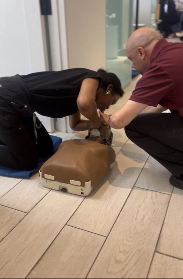 CPR training on dummy mannequin.