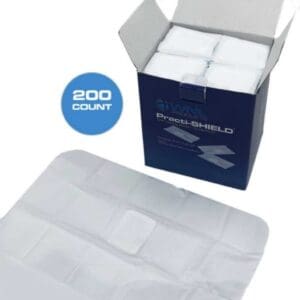 A box of white paper napkins sitting next to each other.