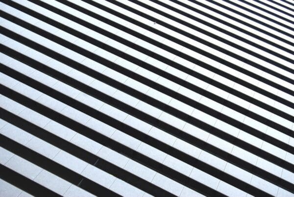 A black and white striped background with lines.
